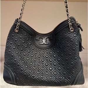 Black Tori Burch leather with gold chain shoulder bag. outer and inner pockets.